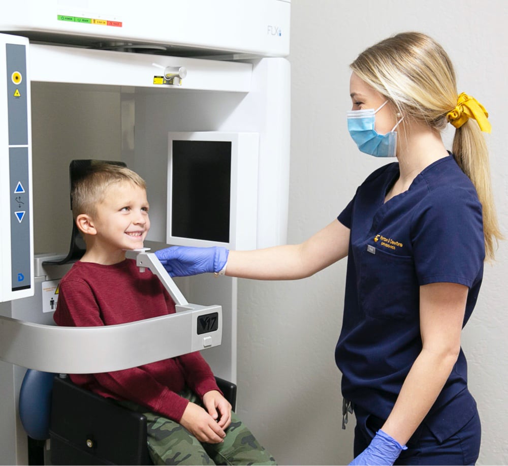young patient and team member smiling during scan